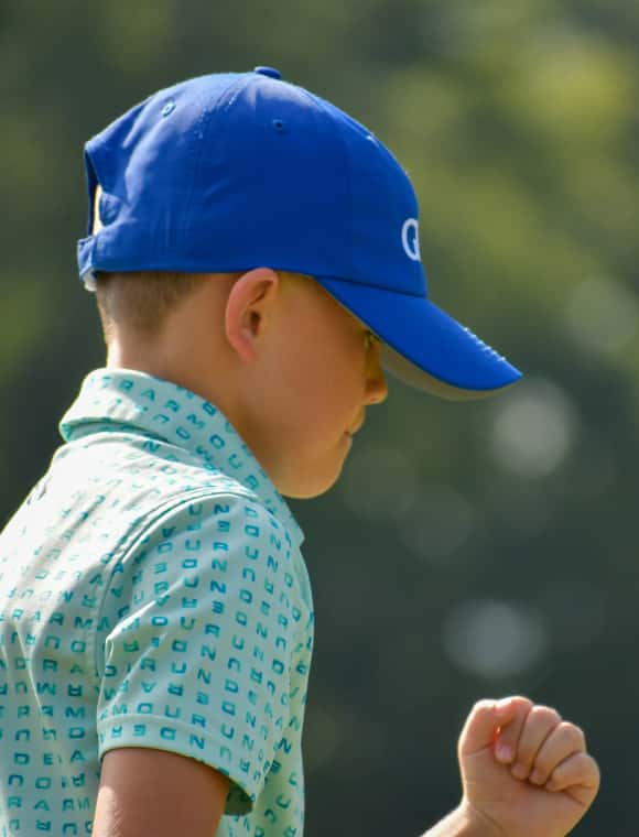 Junior playing golf. 
