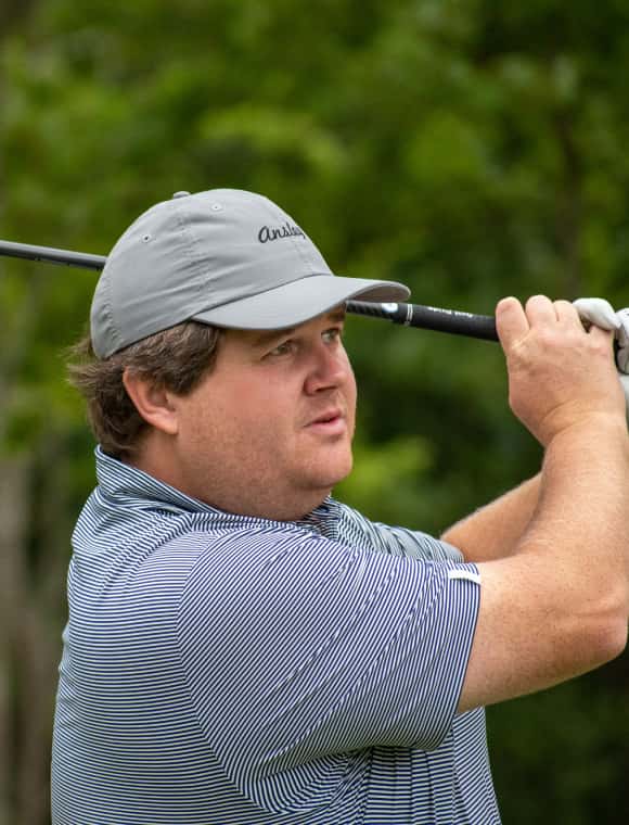 Man golfing. 