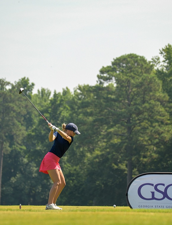 A woman mid-swing during a GSGA competition.