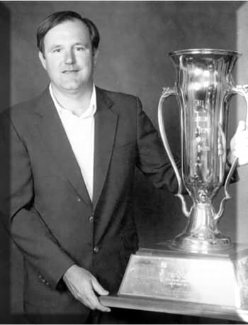 Record-setting Georgia amateur golfer Allen Doye with one of his trophies.