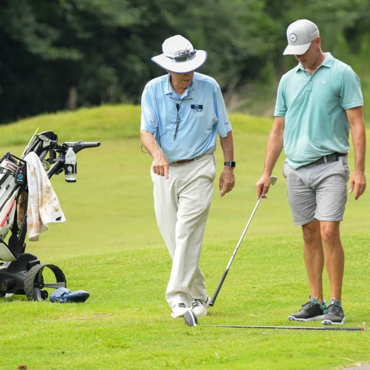 two golfers on the green