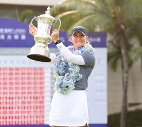 Bailey Tardy lifts the trophy following her first LPGA victory at Blue Bay LPGA on March 10.